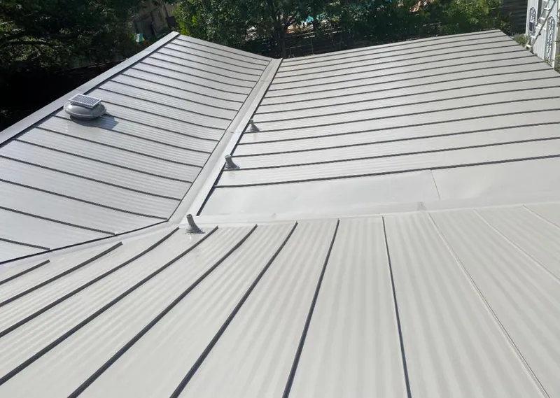 Solar attic fan installed on a metal roof for Roof Ventilation in Mount Kisco